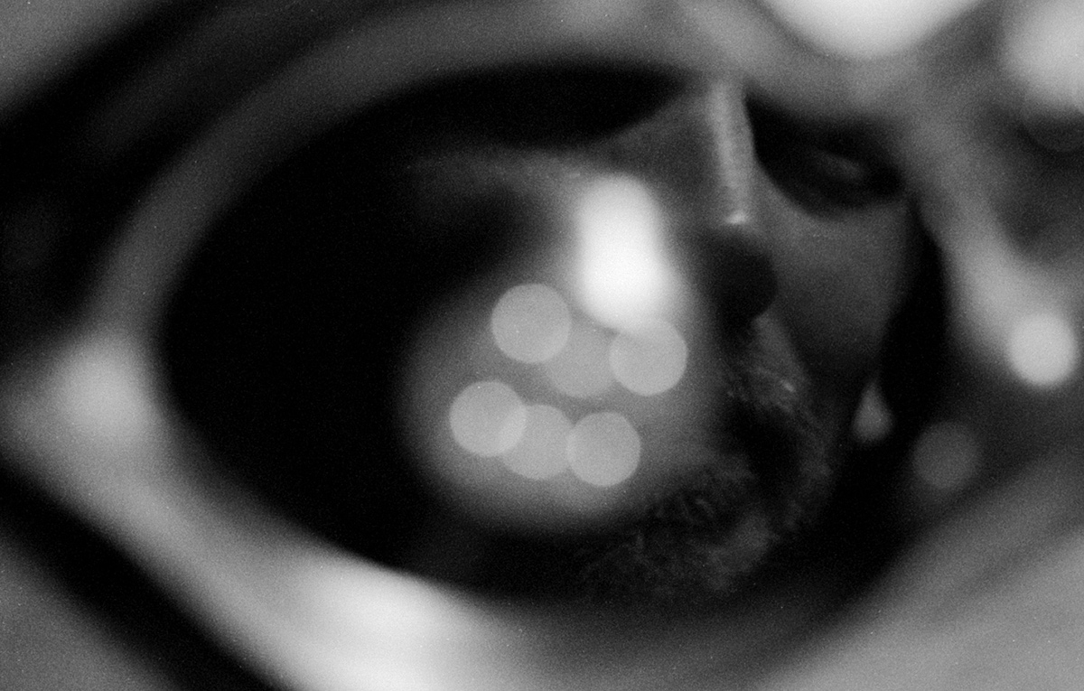 face of man reflected in hard drive